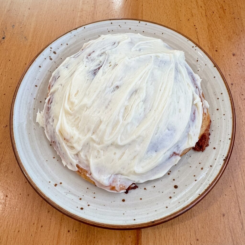 Cinnamon roll donut with cream cheese frosting