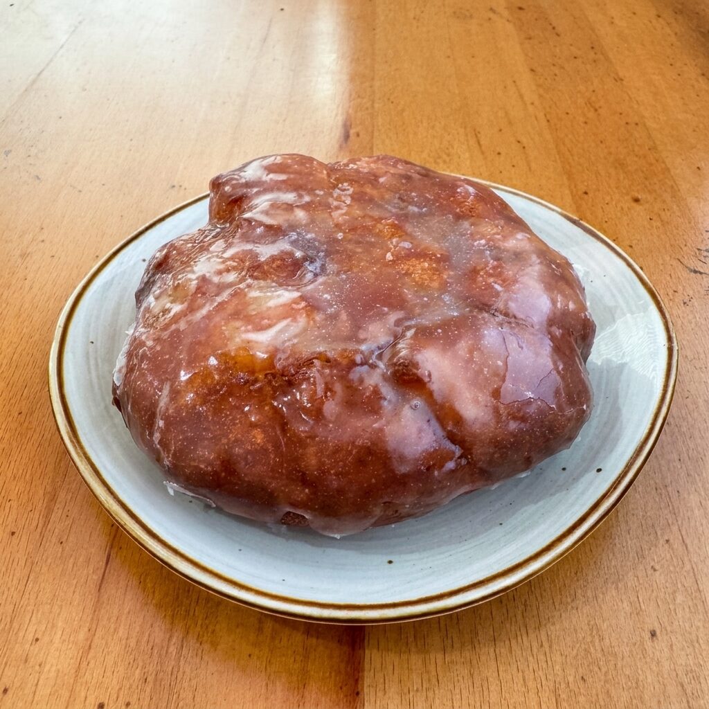 Apple Fritter donut — irregular apple-fritter shape with brown glaze